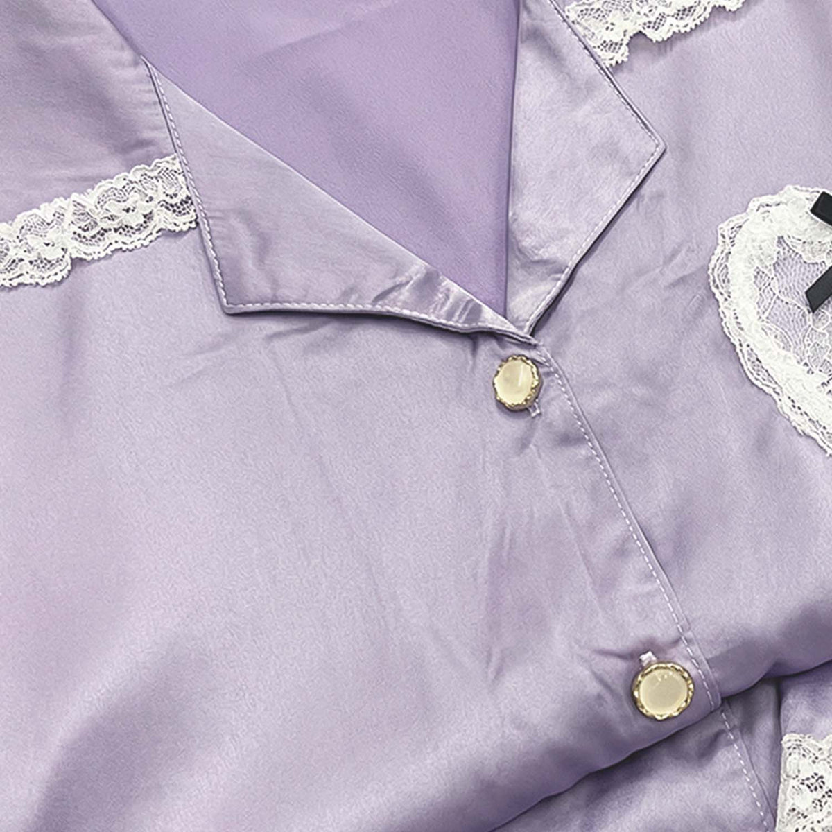 Lavender satin night suit for women, close-up of collar, lace trim and gold buttons
