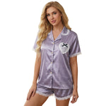 Lavender satin women’s night suit with lace trim, front view on white background