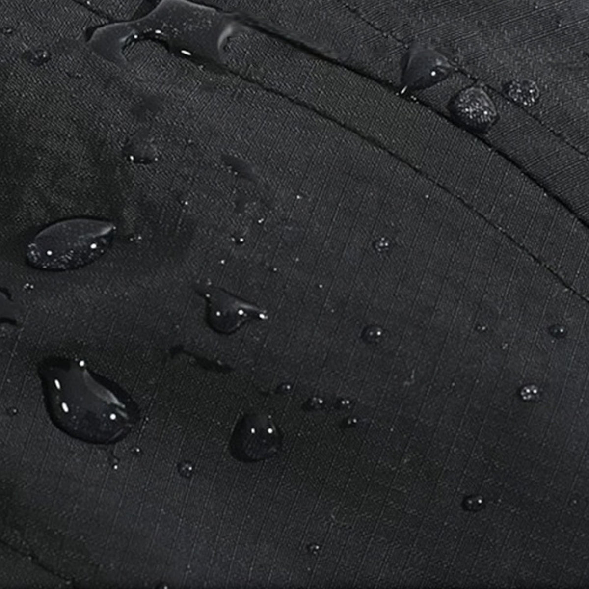 Venzina Water Repellent Cap fabric close-up showing water droplets on black lightweight material