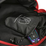 Venzina black interior pocket detail with folded pouch, waterproof foldable backpack inside view