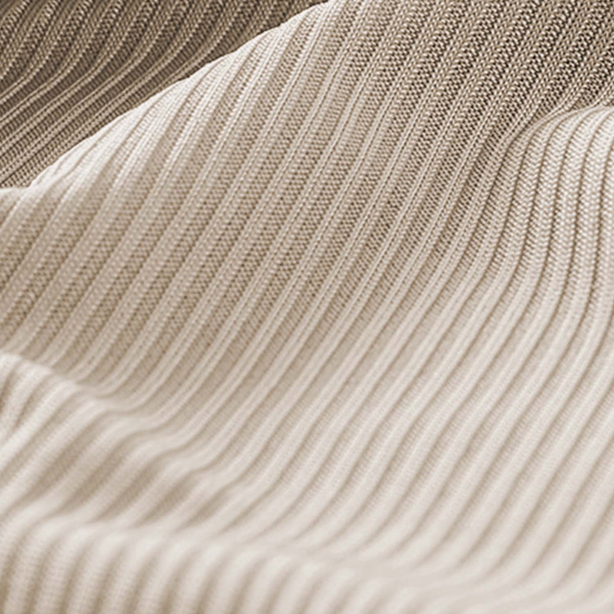 Venzina mens nightwear close-up of beige ribbed fabric draped in soft waves, highlighting fine knit texture and stretch detail