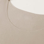 Venzina night suit for men close-up of beige ribbed neckline, showing seamless stitching and fine knit texture on flat surface