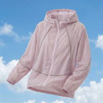 Venzina pink hooded sun protection lightweight jacket, angled product-only view on blue sky background