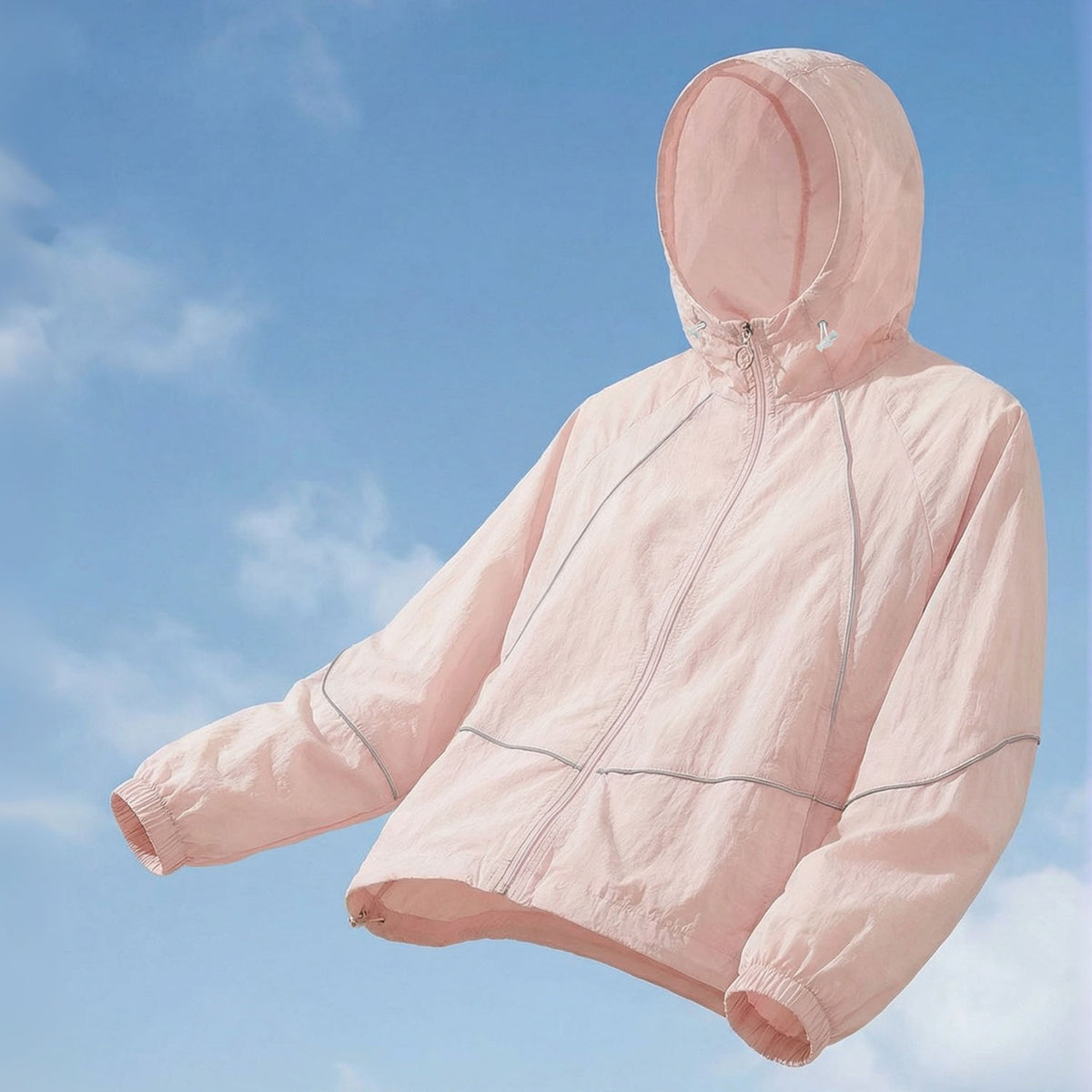Venzina sun protection jacket for women in peach pink, hood-up floating product view, blue sky background