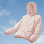 Venzina sun protection jacket for women in peach pink, hood-up floating product view, blue sky background