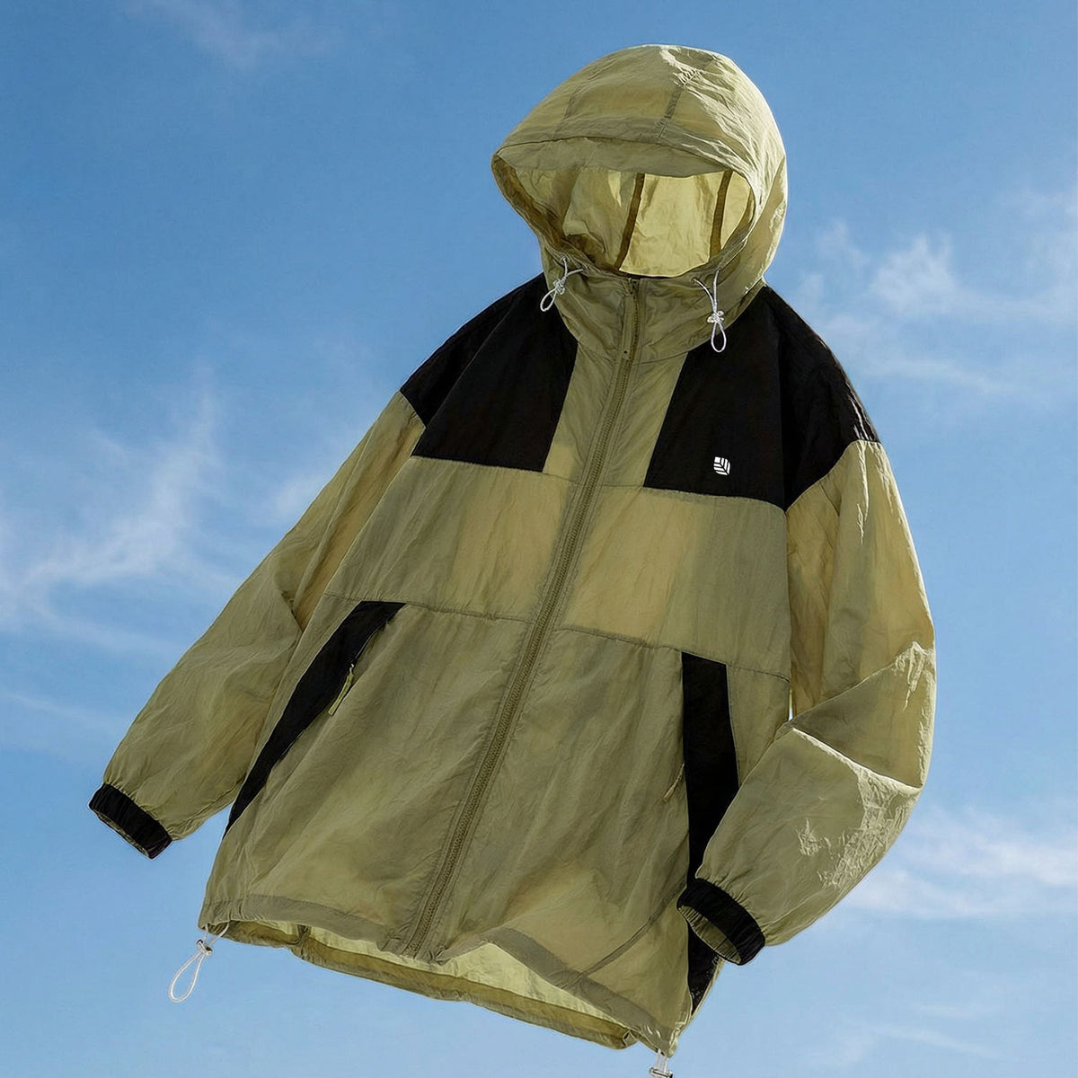 Venzina sunscreen jacket laid flat, top view of olive-black color-block hood with visor and drawcords, blue sky background