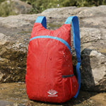 Venzina waterproof foldable backpack on wet rocks, lightweight nylon travel daypack