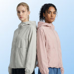 Venzina women's sun protection jacket worn side-by-side view, light beige and soft pink hooded jackets shown from side profile on light blue background