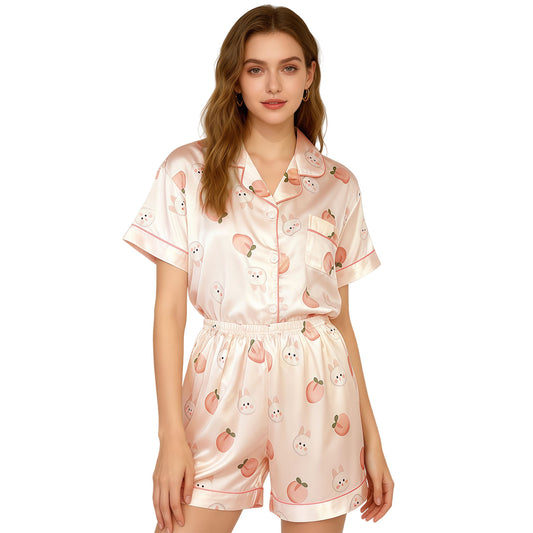 Pink satin women’s night suit front view with short-sleeve top and shorts