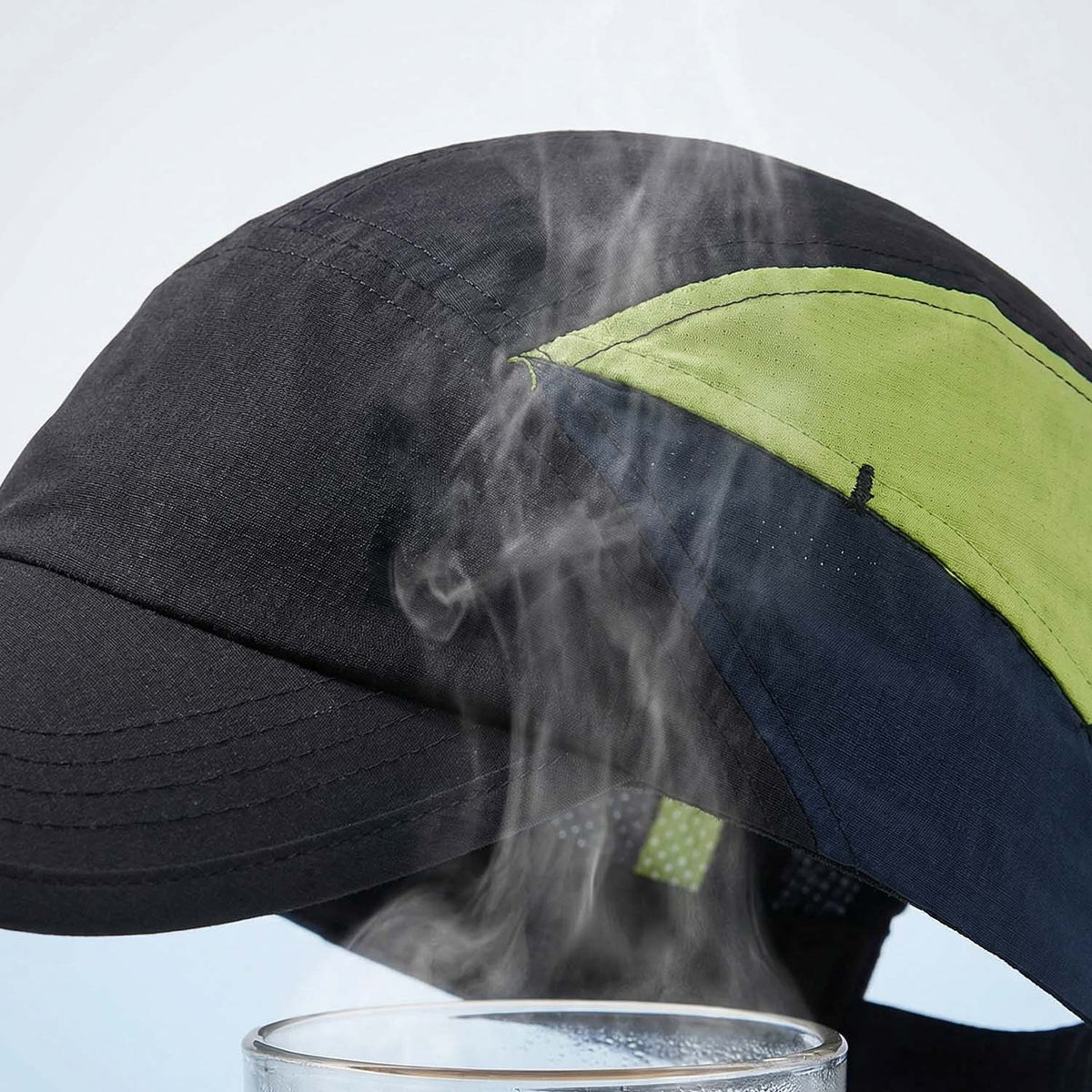 Venzina Breathable Cap close-up showing ventilation panel releasing steam above hot water
