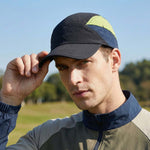 Venzina Running Cap worn by man outdoors adjusting curved brim under clear sky