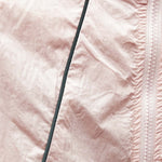 Venzina uv jacket women close-up, blush fabric texture with zipper tape and seam stitching detail