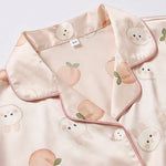 Women’s pink satin night suit with peach and bunny print, collar detail view